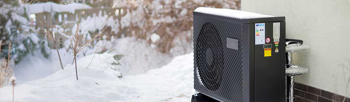 Air Source Heat Pump outside in winter